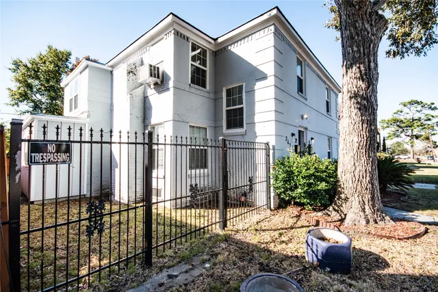 a view of a house with a small yard and plants