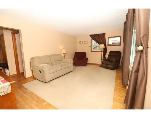 18 Rita Street Lowell, MA 01854 - Photo 5 of 14 a living room with furniture and a flat screen tv