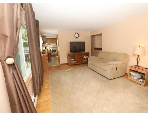 18 Rita Street Lowell, MA 01854 - Photo 6 of 14 a living room with furniture and a flat screen tv