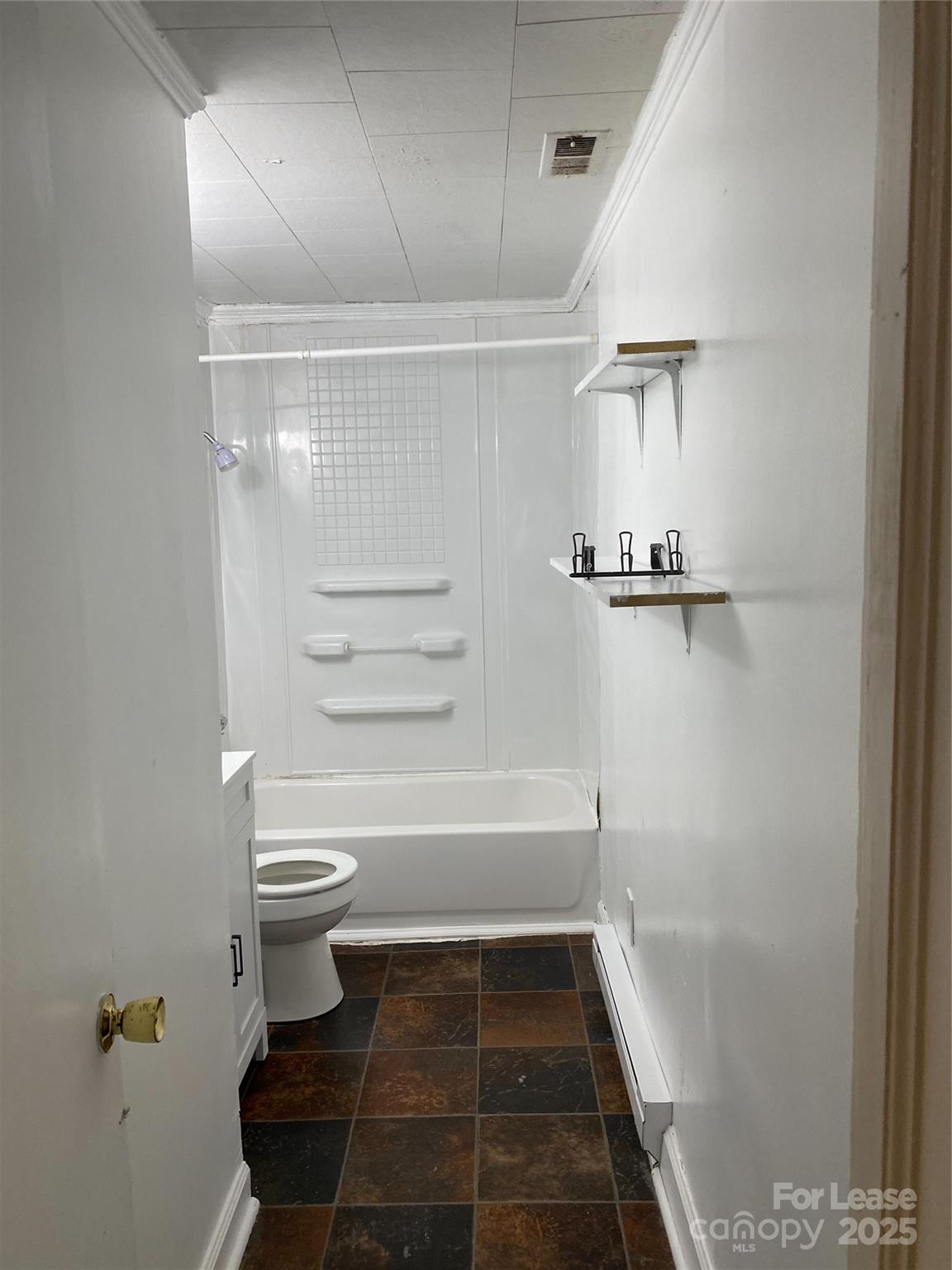 1345 Standish Street, Unit A Salisbury, NC 28144 - Photo 11 of 16 a bathroom with a toilet and a shower