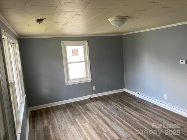 a kitchen with granite countertop a sink stove and cabinets