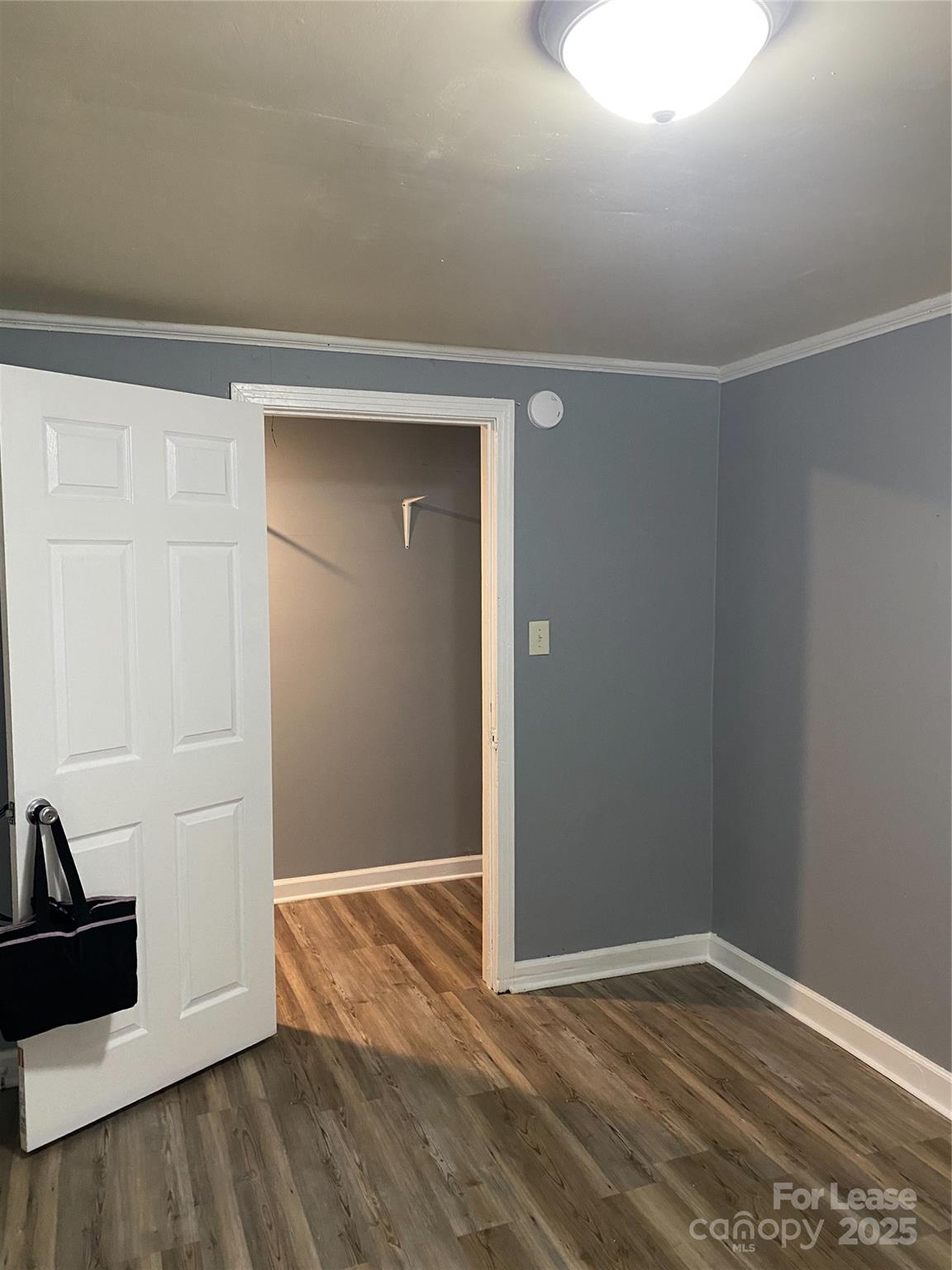 1345 Standish Street, Unit A Salisbury, NC 28144 - Photo 5 of 16 an empty room with wooden floor and closet