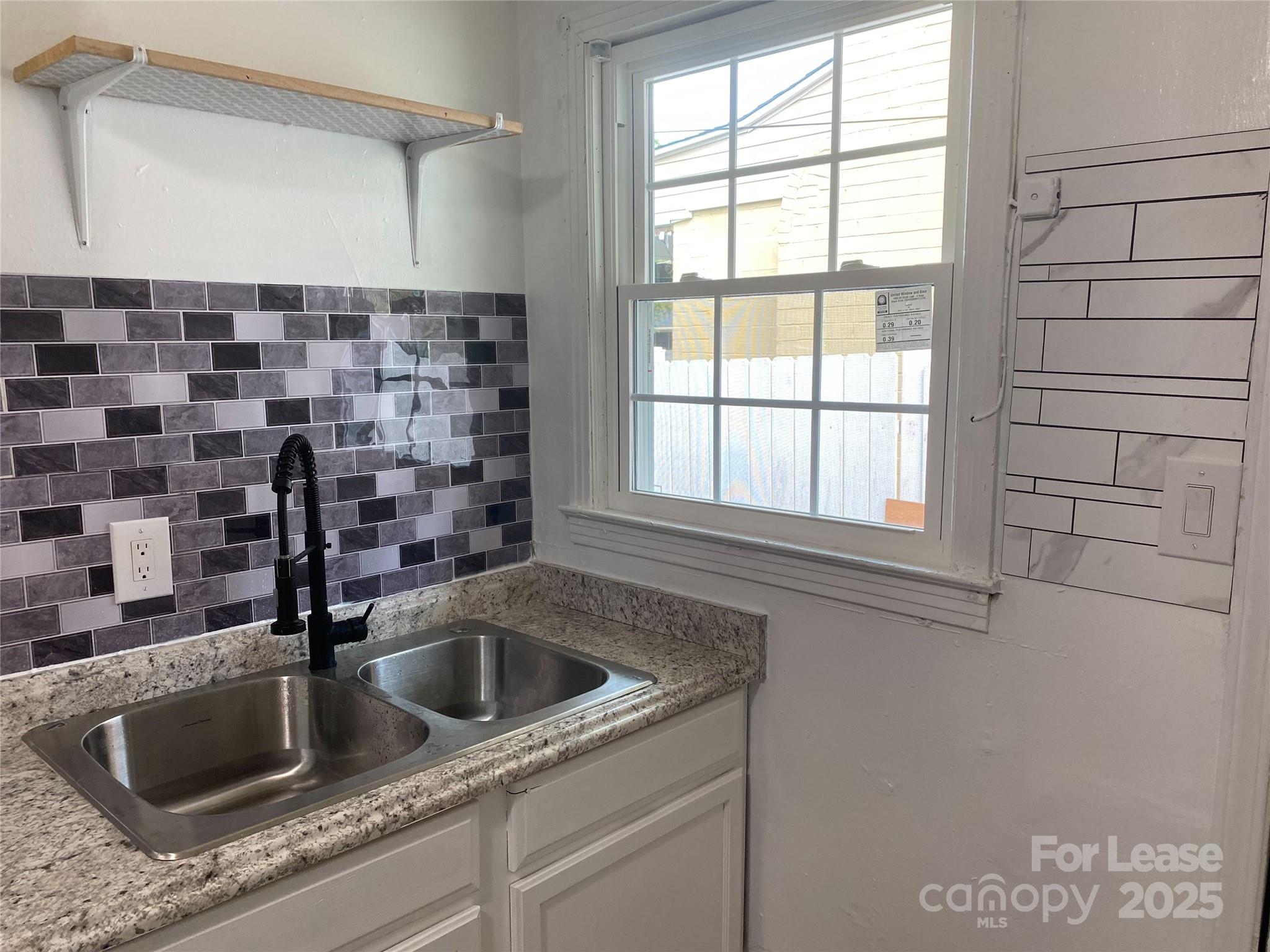 1345 Standish Street, Unit A Salisbury, NC 28144 - Photo 10 of 16 a kitchen with a sink and cabinets