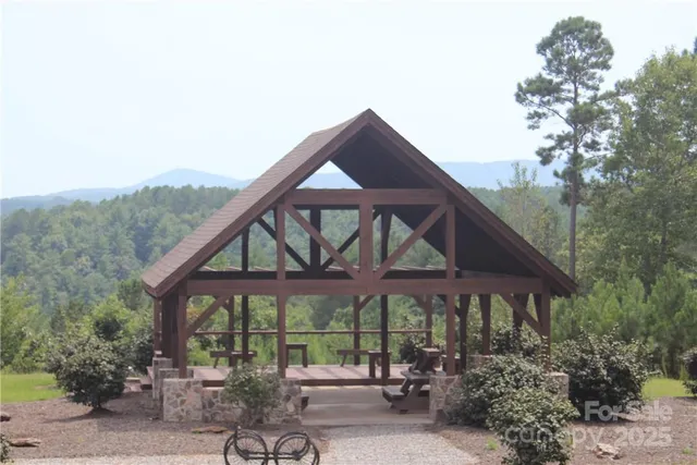 a view of porch with a table and chairs