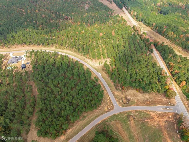 a view of a street with a building in the background