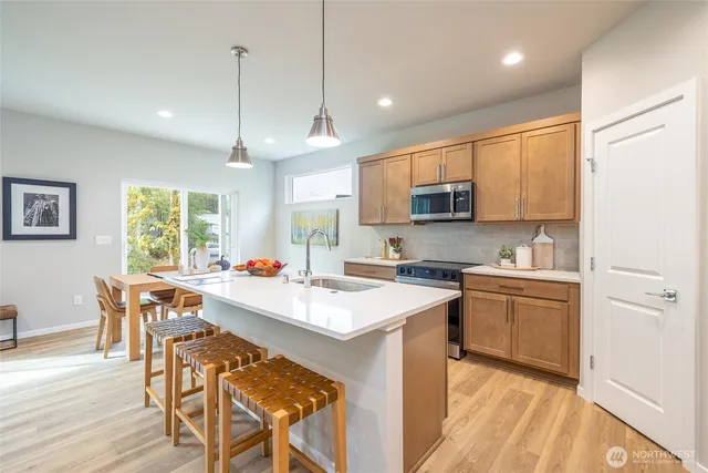 a spacious bedroom with a bed and a couch