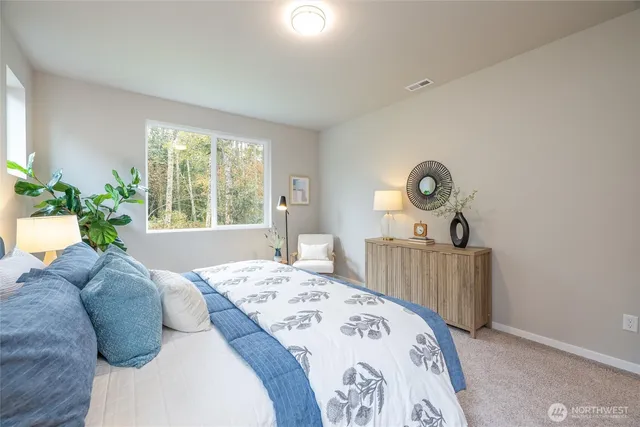 a bedroom with a bed and furniture