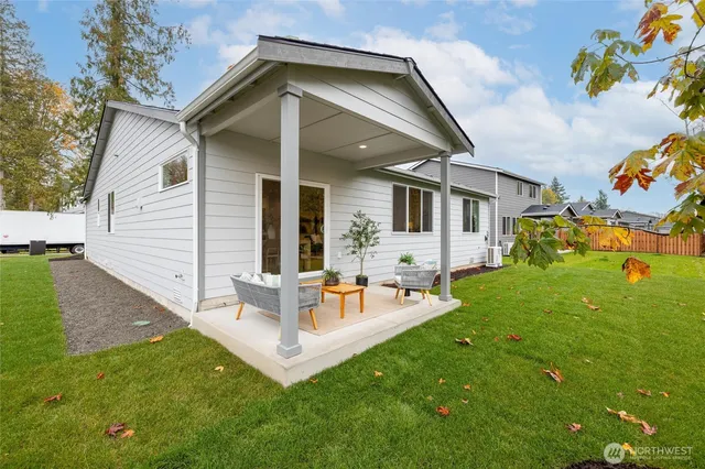 a kitchen with stainless steel appliances granite countertop a sink refrigerator and microwave