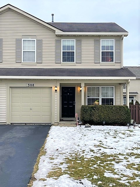 308 Richfield Trail Romeoville, IL 60446 - Photo 1 of 18 a front view of a house with a yard and garage