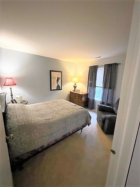 308 Richfield Trail Romeoville, IL 60446 - Photo 13 of 18 a bedroom with a bed and wooden floor