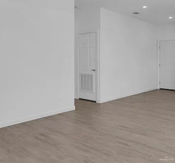 1312 Lore Drive, Unit 1 Weslaco, TX 78599 - Photo 5 of 10 Unfurnished room wit. h light wood finished floors and baseboards