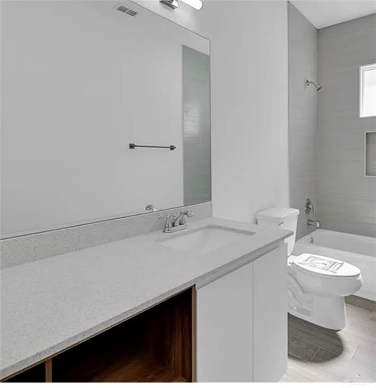 1312 Lore Drive, Unit 1 Weslaco, TX 78599 - Photo 10 of 10 Bathroom featuring vanity and shower / bath combination