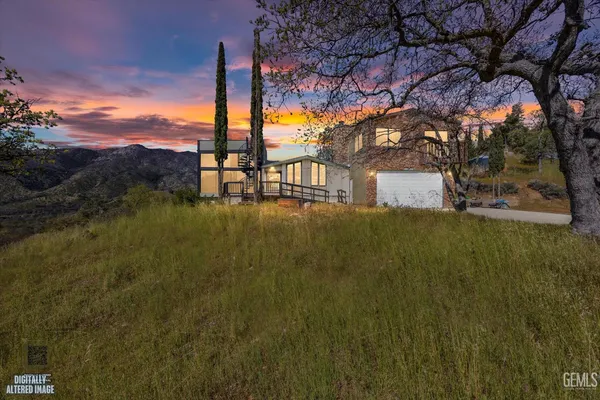 an aerial view of a house with outdoor space