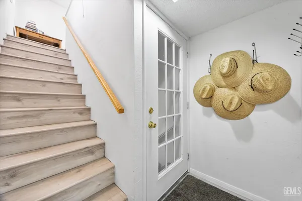 a picture of a bathroom with a white wall