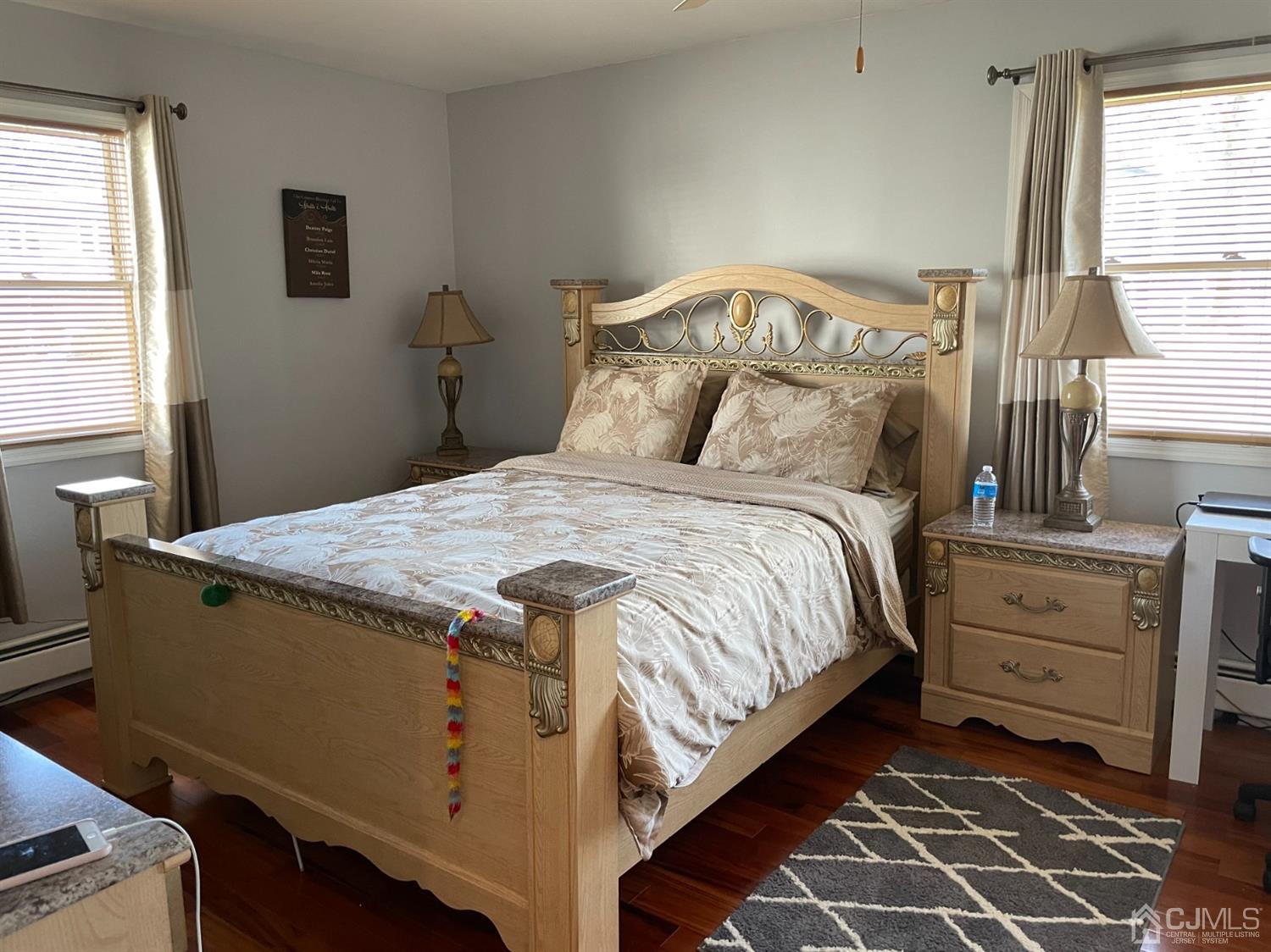 43 Brookville Road Edison, NJ 08817 - Photo 11 of 31 a bed sitting in a bedroom next to a window