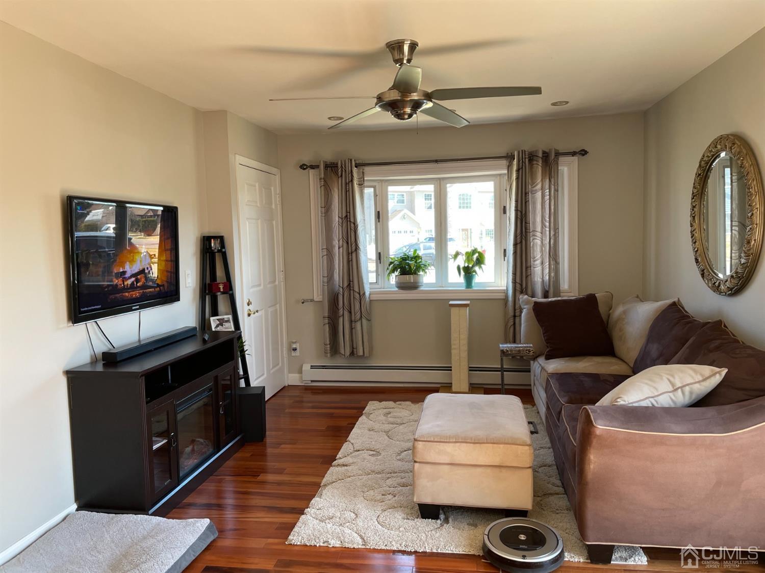 43 Brookville Road Edison, NJ 08817 - Photo 6 of 31 a living room with furniture and a flat screen tv