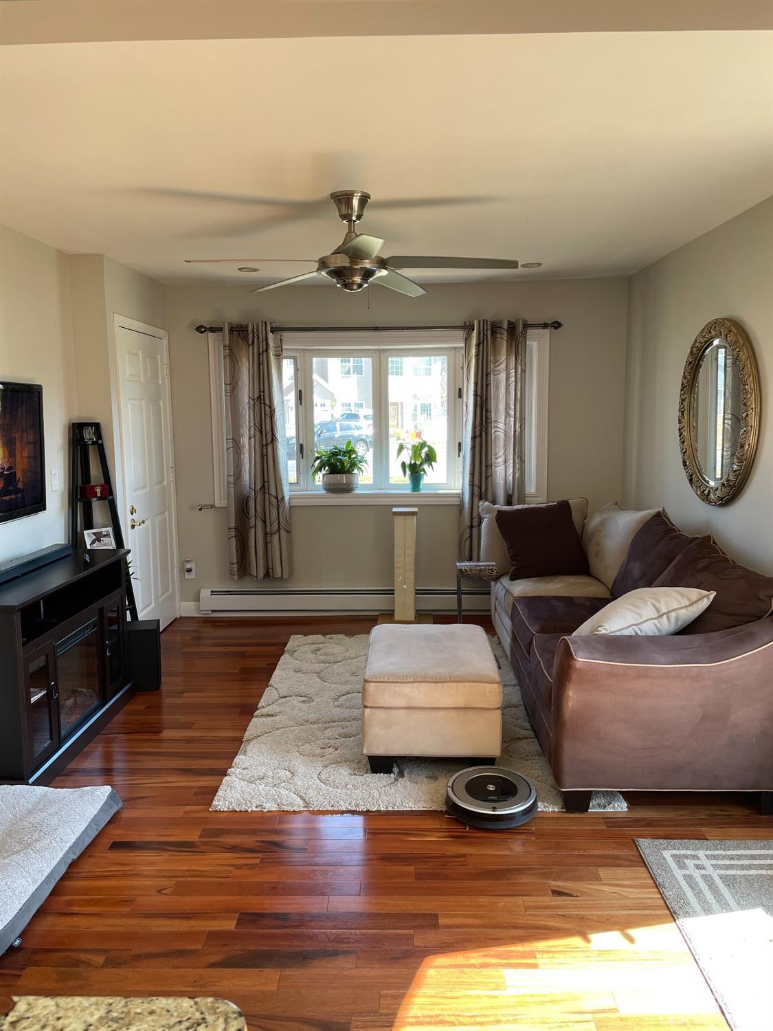 43 Brookville Road Edison, NJ 08817 - Photo 7 of 31 a living room with furniture and a flat screen tv