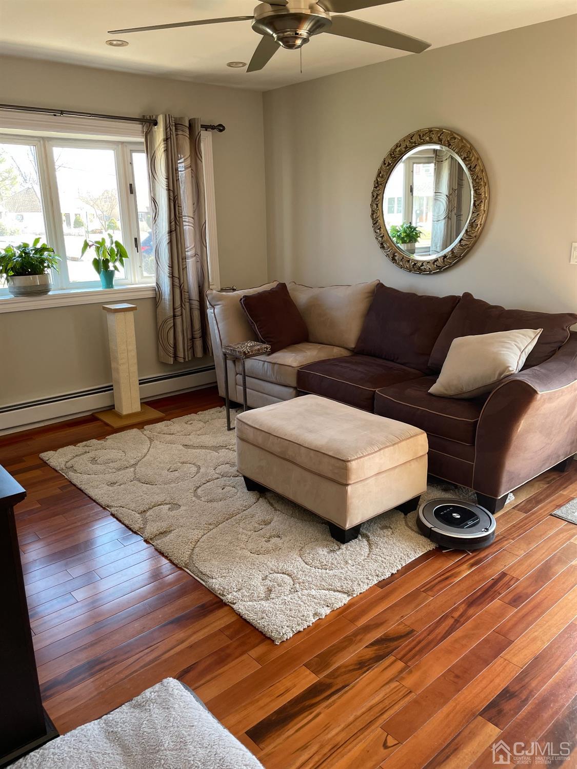 43 Brookville Road Edison, NJ 08817 - Photo 9 of 31 a living room with furniture and a wooden floor