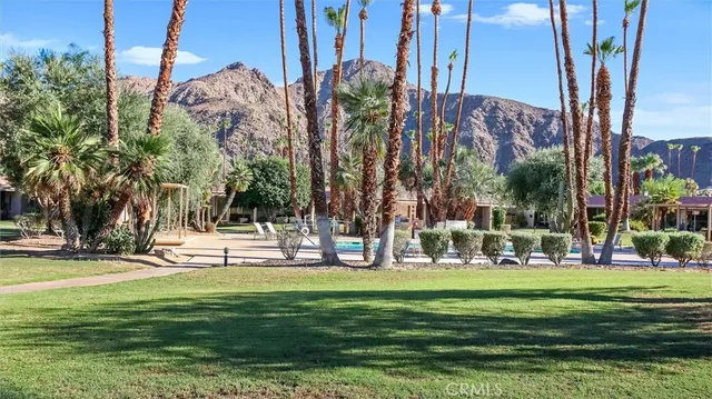 a building view with a garden and trees