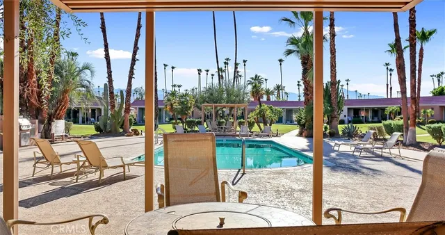 a view of a swimming pool with a patio
