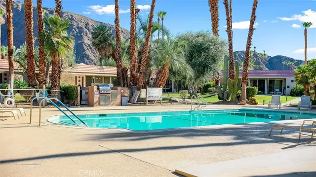 a view of a house with a yard and plants