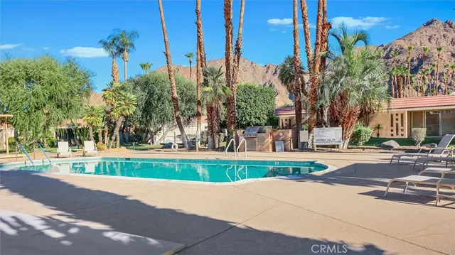 a view of a park with large trees