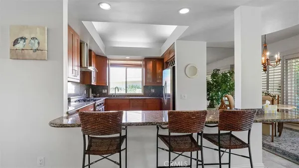 a view of a dining room with furniture and window