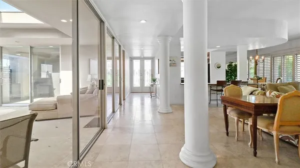 a view of a lobby with furniture and floor to ceiling window
