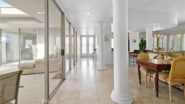 a view of a lobby with furniture and floor to ceiling window