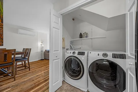a view of a storage & utility room with racks on the wall