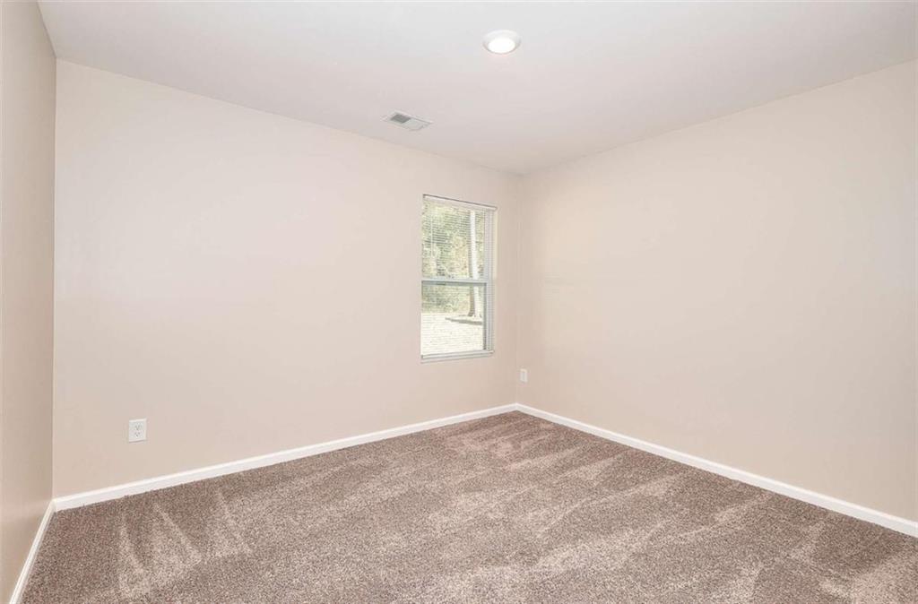 407 Wall Street Monroe, GA 30655 - Photo 16 of 51 an empty room with a window