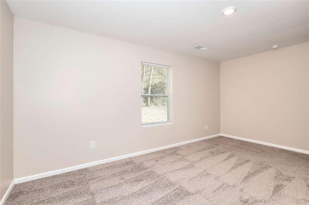 407 Wall Street Monroe, GA 30655 - Photo 23 of 51 an empty room with a window