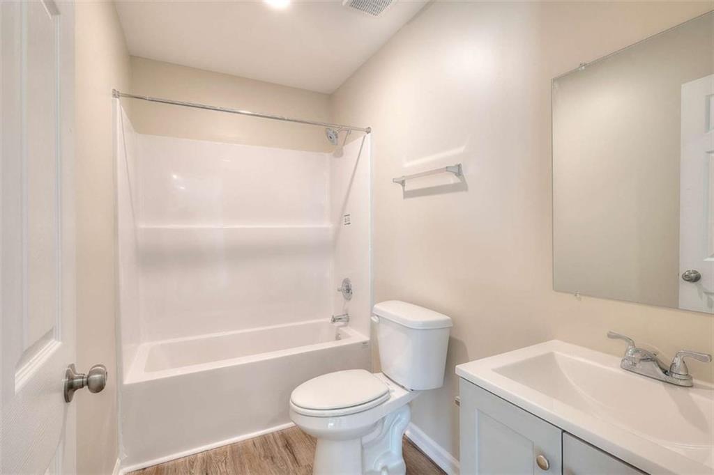 407 Wall Street Monroe, GA 30655 - Photo 26 of 51 a bathroom with a sink toilet and shower