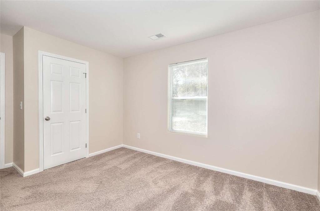 407 Wall Street Monroe, GA 30655 - Photo 27 of 51 a view of an empty room with a window