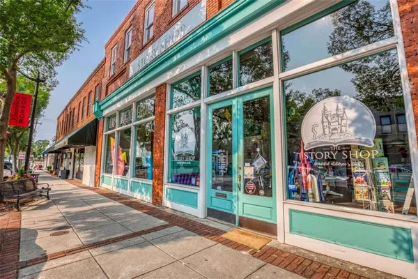 a view of a building with a window and glass door