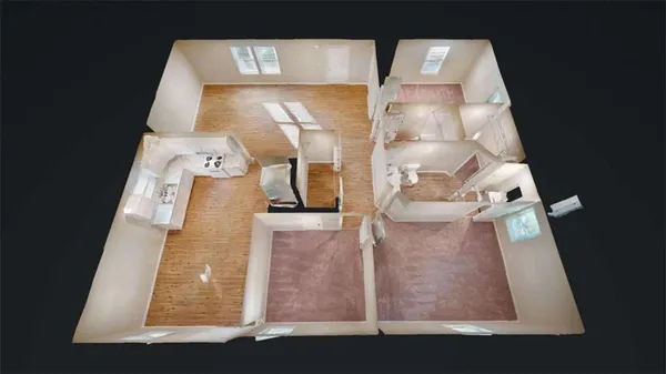 an aerial view of a house with a yard