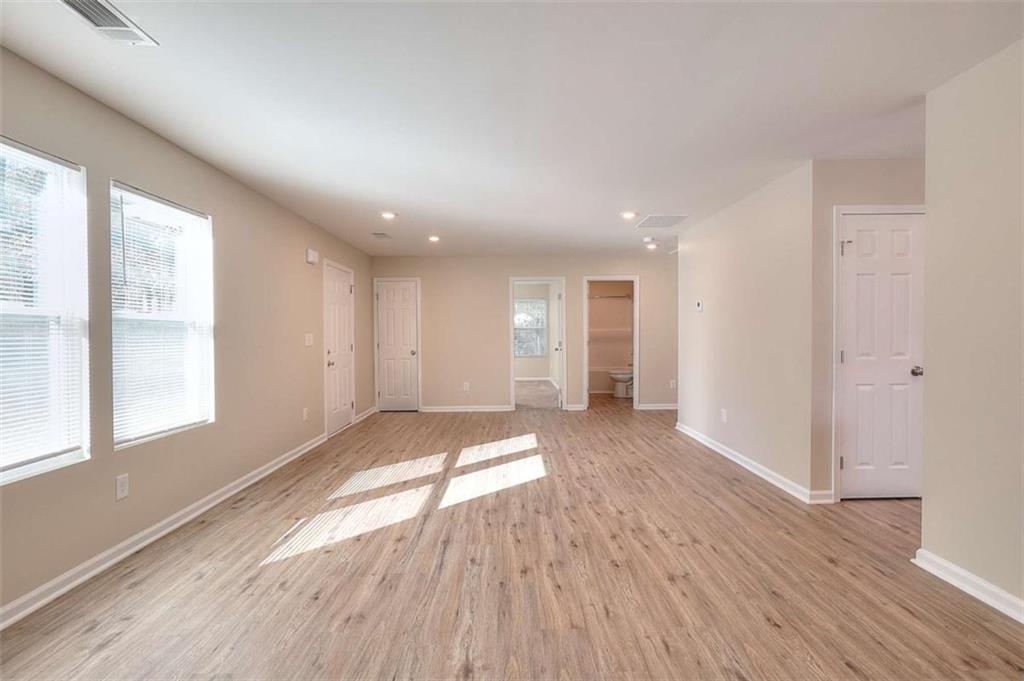 407 Wall Street Monroe, GA 30655 - Photo 10 of 51 a view of empty room with wooden floor and fan