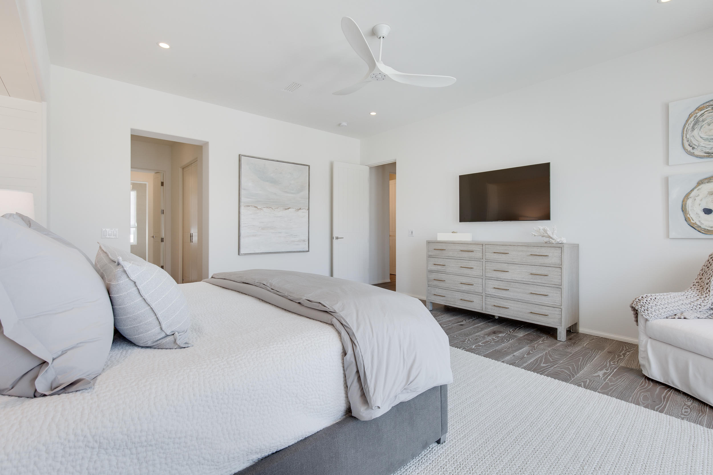 19 Astra Way Inlet Beach, Unit M11 Inlet Beach, FL 32461 - Photo 12 of 34 a bedroom with a bed a mirror and a television