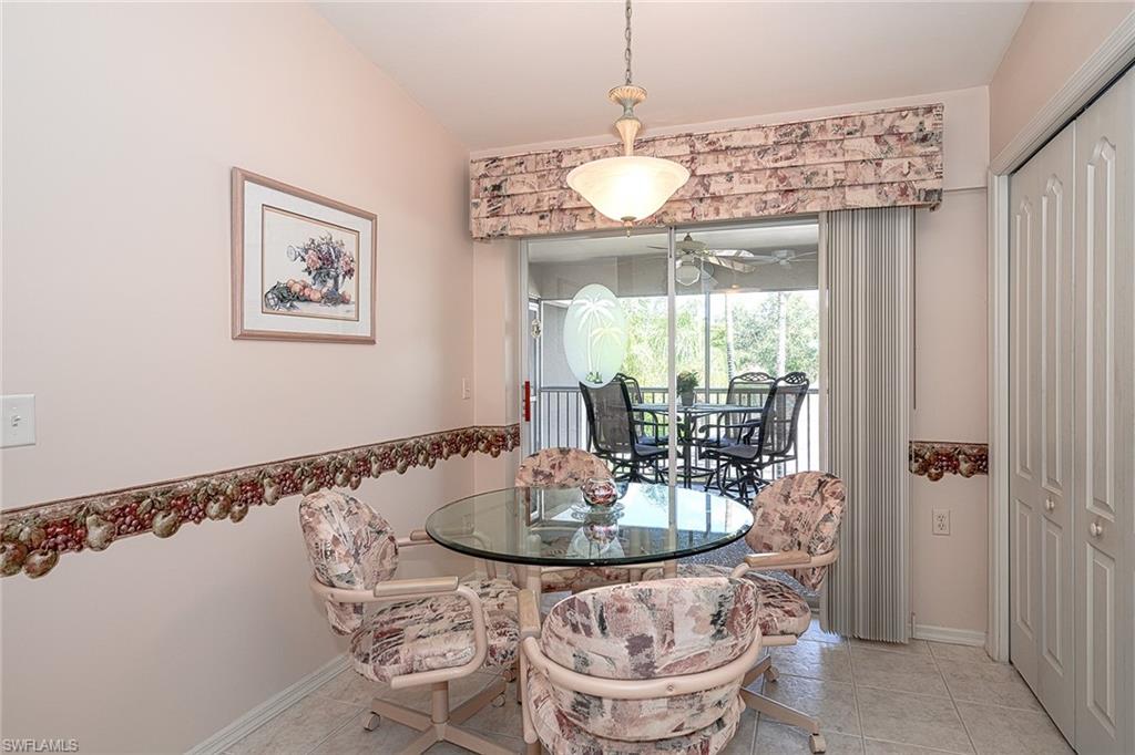 8640 Cedar Hammock Circle, Unit 523 Naples, FL 34112 - Photo 12 of 29 a view of a dining room with furniture window and outside view