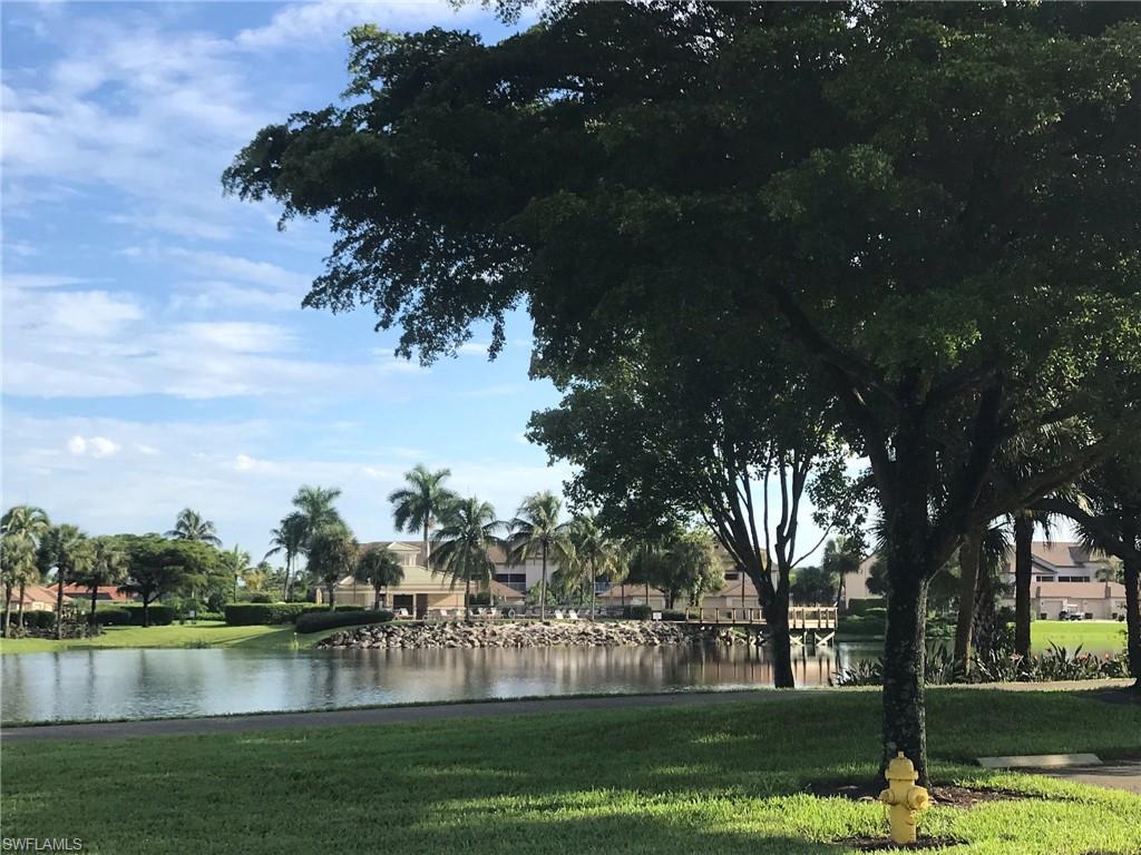 8640 Cedar Hammock Circle, Unit 523 Naples, FL 34112 - Photo 23 of 29 a view of a lake with houses