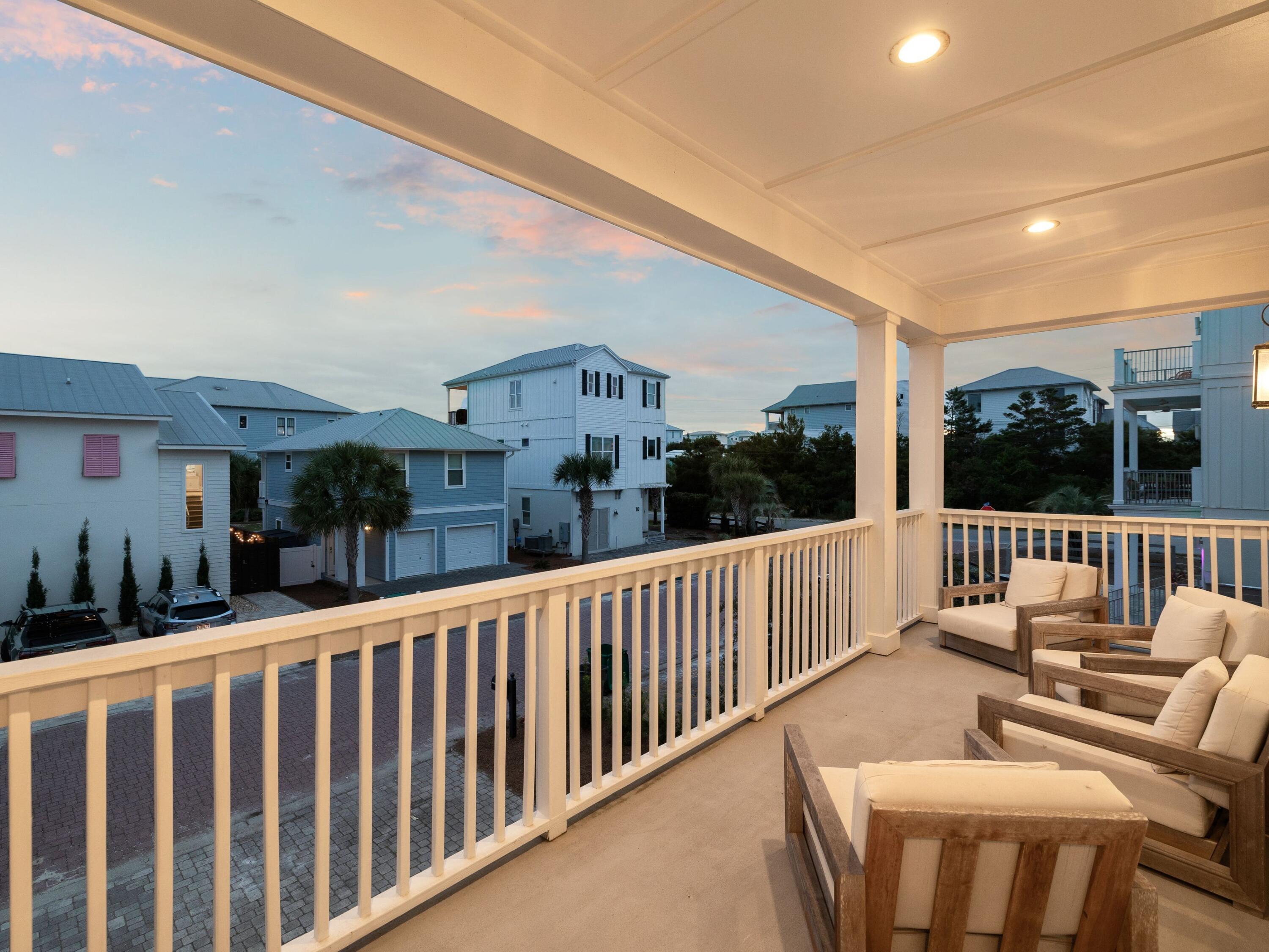 29 Tidewater Ct Inlet Beach Inlet Beach, FL 32461 - Photo 6 of 25 a view of a chair and tables in the balcony