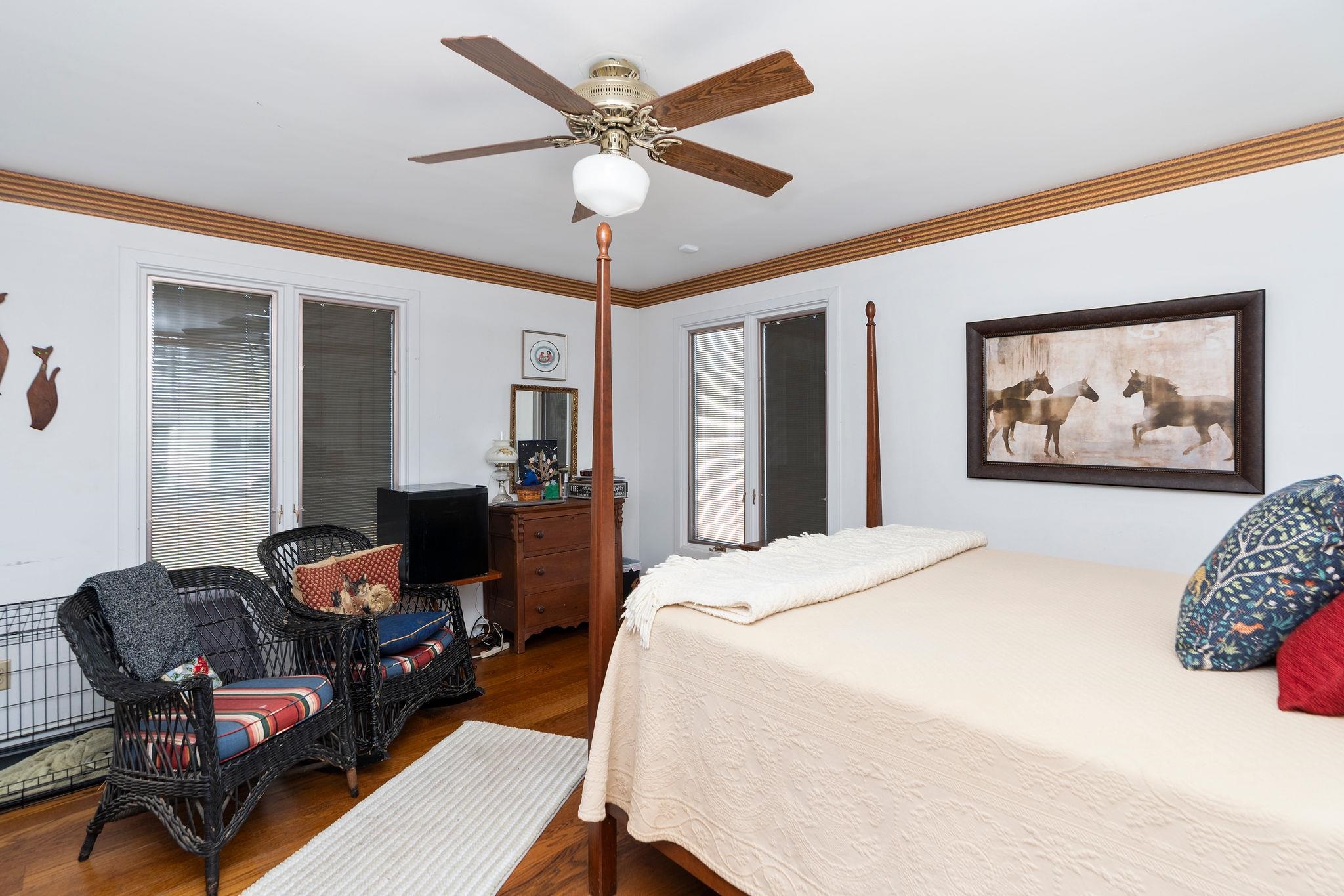 129 Shemariah Road Middlebrook, VA 24459 - Photo 28 of 75 a bedroom with a bed painting on wall and a large window
