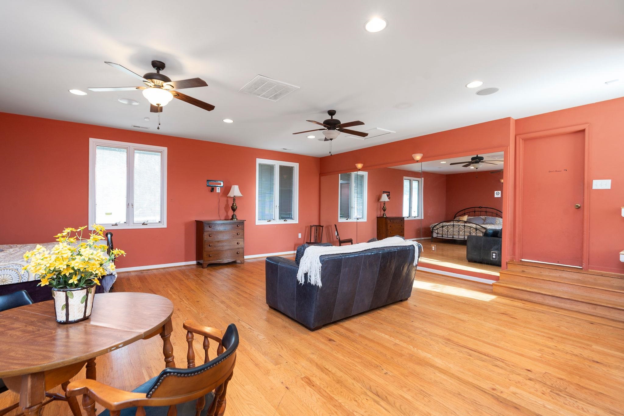 129 Shemariah Road Middlebrook, VA 24459 - Photo 34 of 75 a living room with furniture and a chandelier