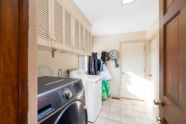 a view of swimming pool with outdoor seating and city view