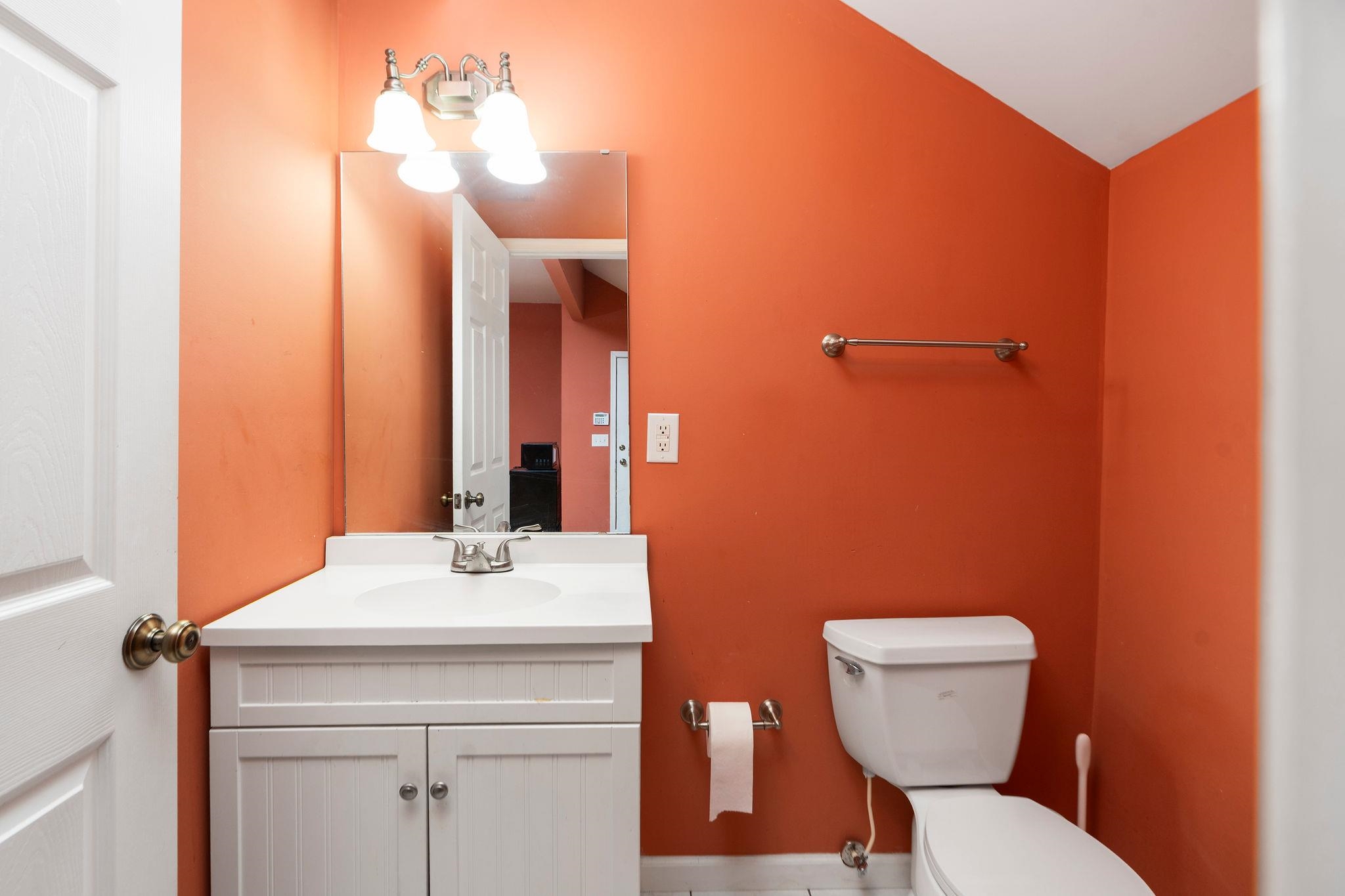 129 Shemariah Road Middlebrook, VA 24459 - Photo 38 of 75 a bathroom with a toilet a sink and mirror
