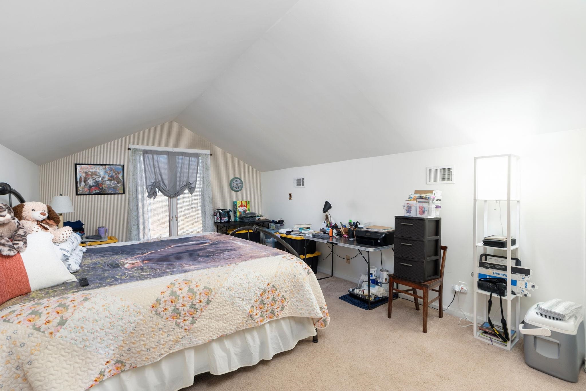 129 Shemariah Road Middlebrook, VA 24459 - Photo 40 of 75 a bedroom with a bed and a chandelier