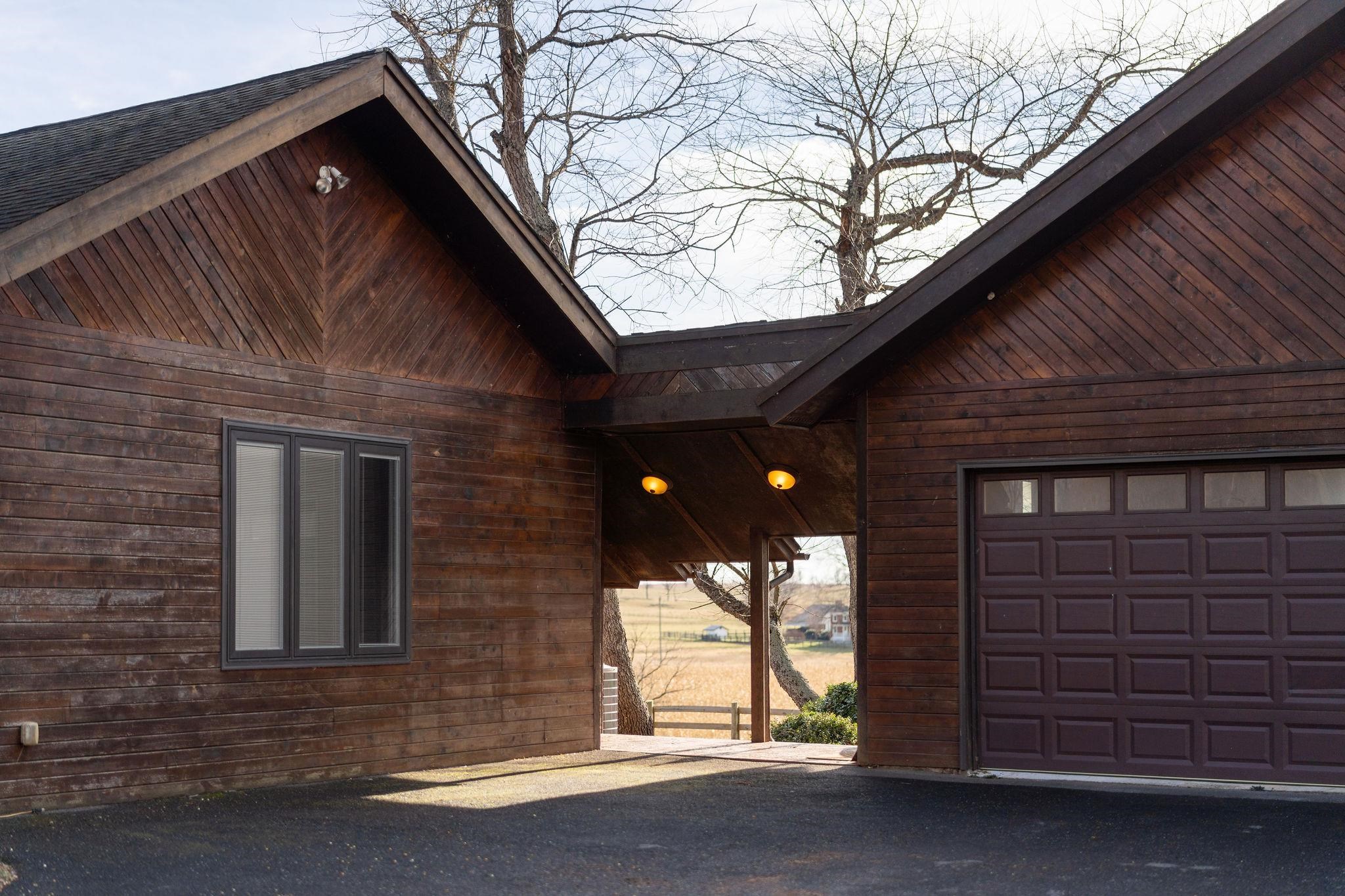 129 Shemariah Road Middlebrook, VA 24459 - Photo 4 of 75 a front view of a house with a garage