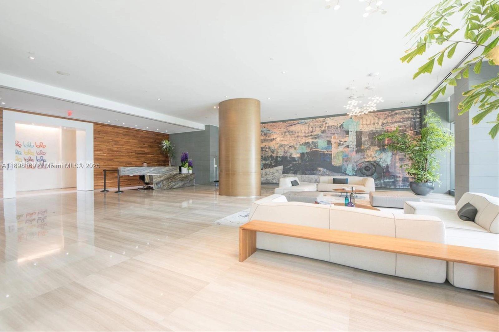 460 Northeast 28th Street, Unit 1901 Miami, FL 33137 - Photo 31 of 34 a living room with furniture and a large window