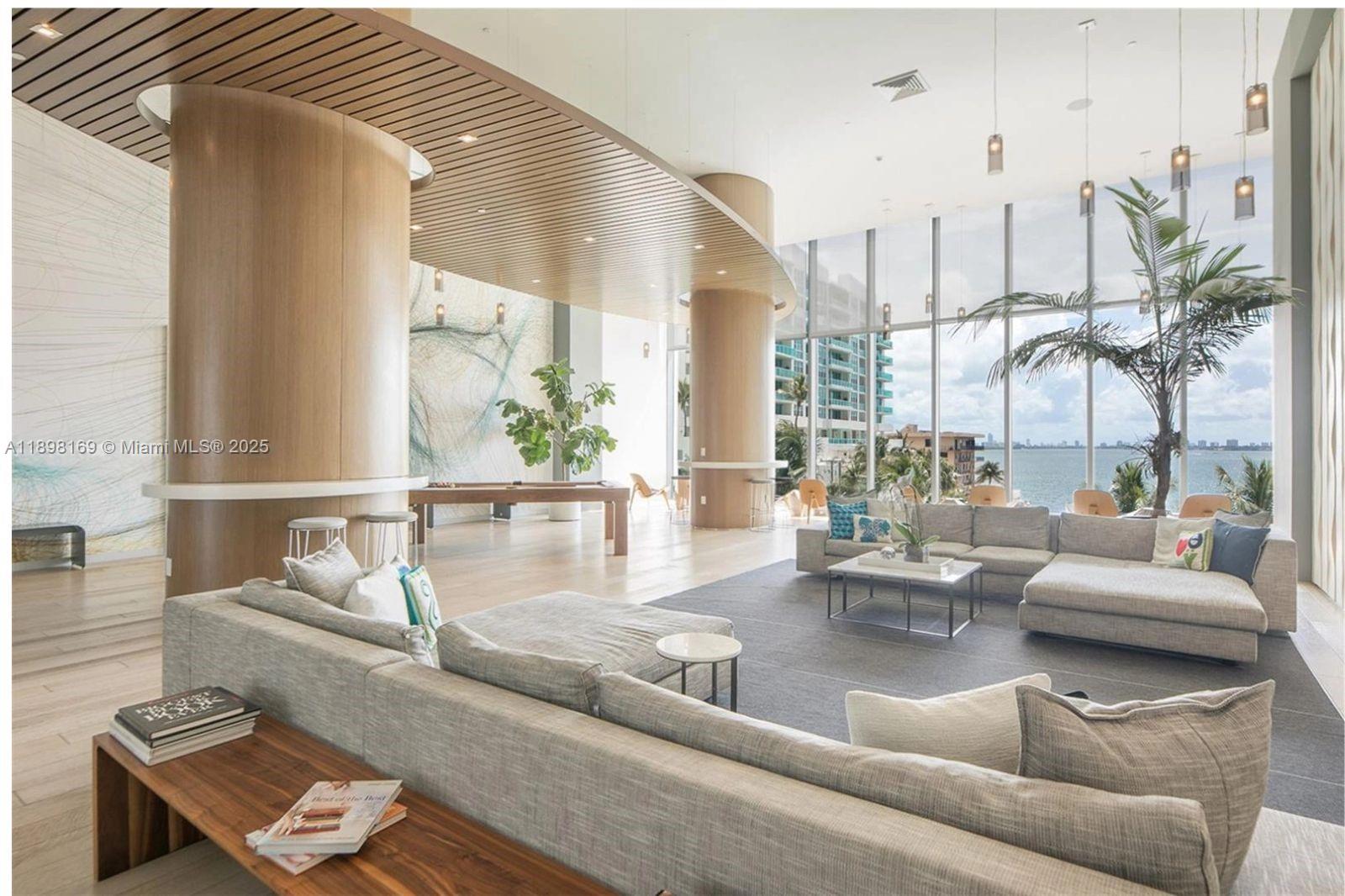 460 Northeast 28th Street, Unit 1901 Miami, FL 33137 - Photo 32 of 34 a living room with furniture and a large window