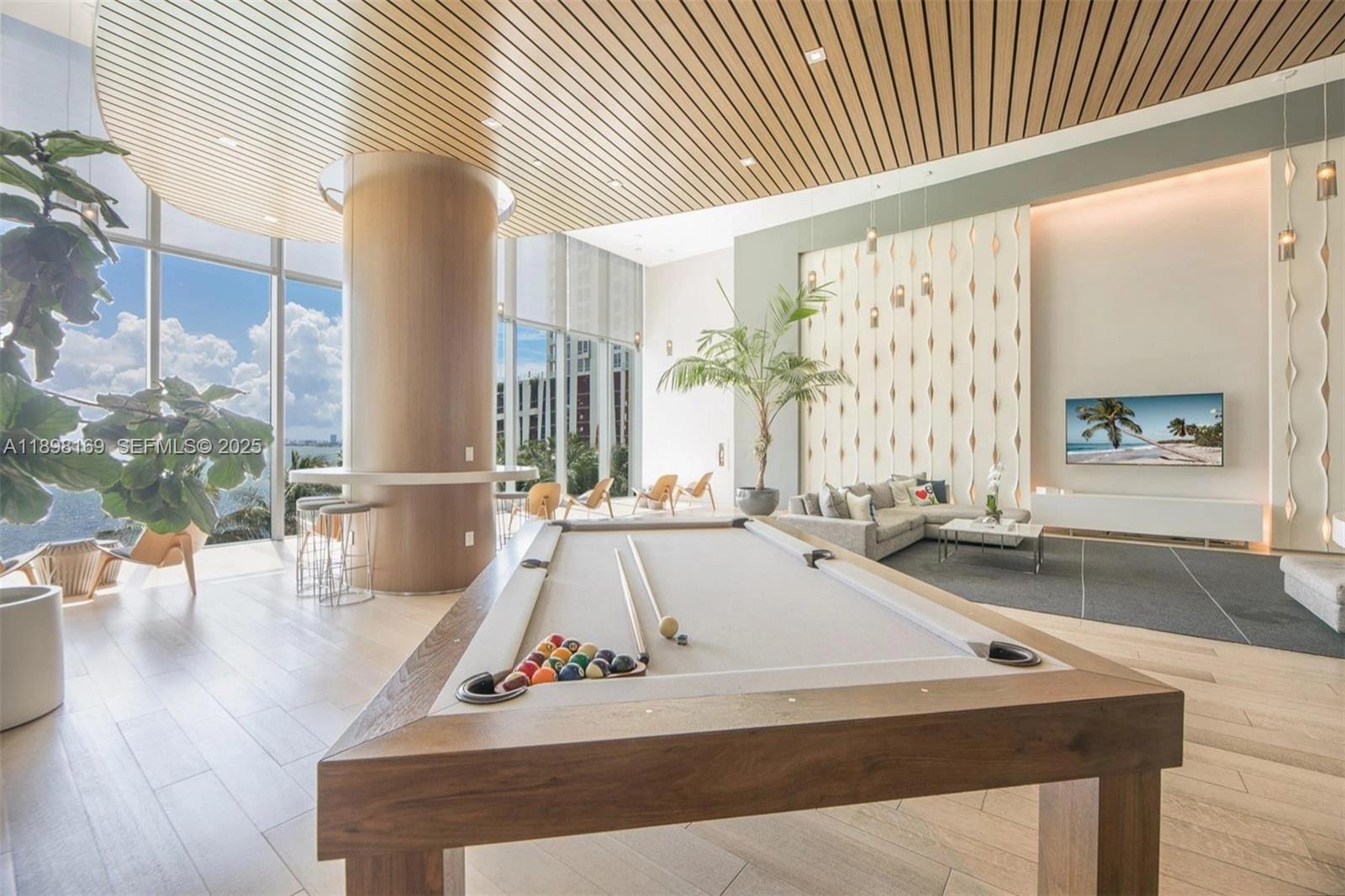 460 Northeast 28th Street, Unit 1901 Miami, FL 33137 - Photo 33 of 34 a view of a living room and bathroom with a large window